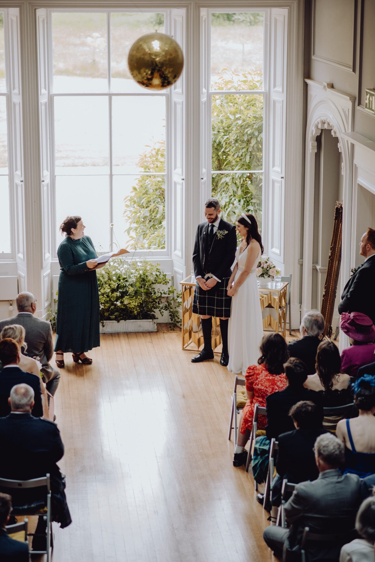 Bride and groom being addressed by the celebrant