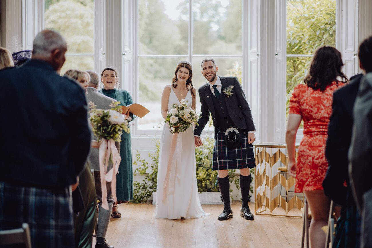 Bride and groom laughing after exchanging vows