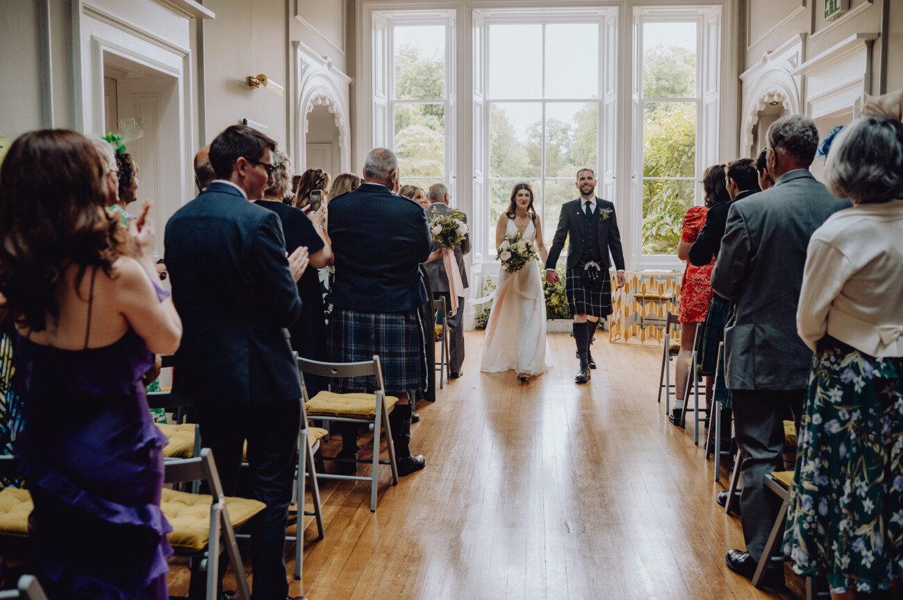 Bride and groom walking down the aisle