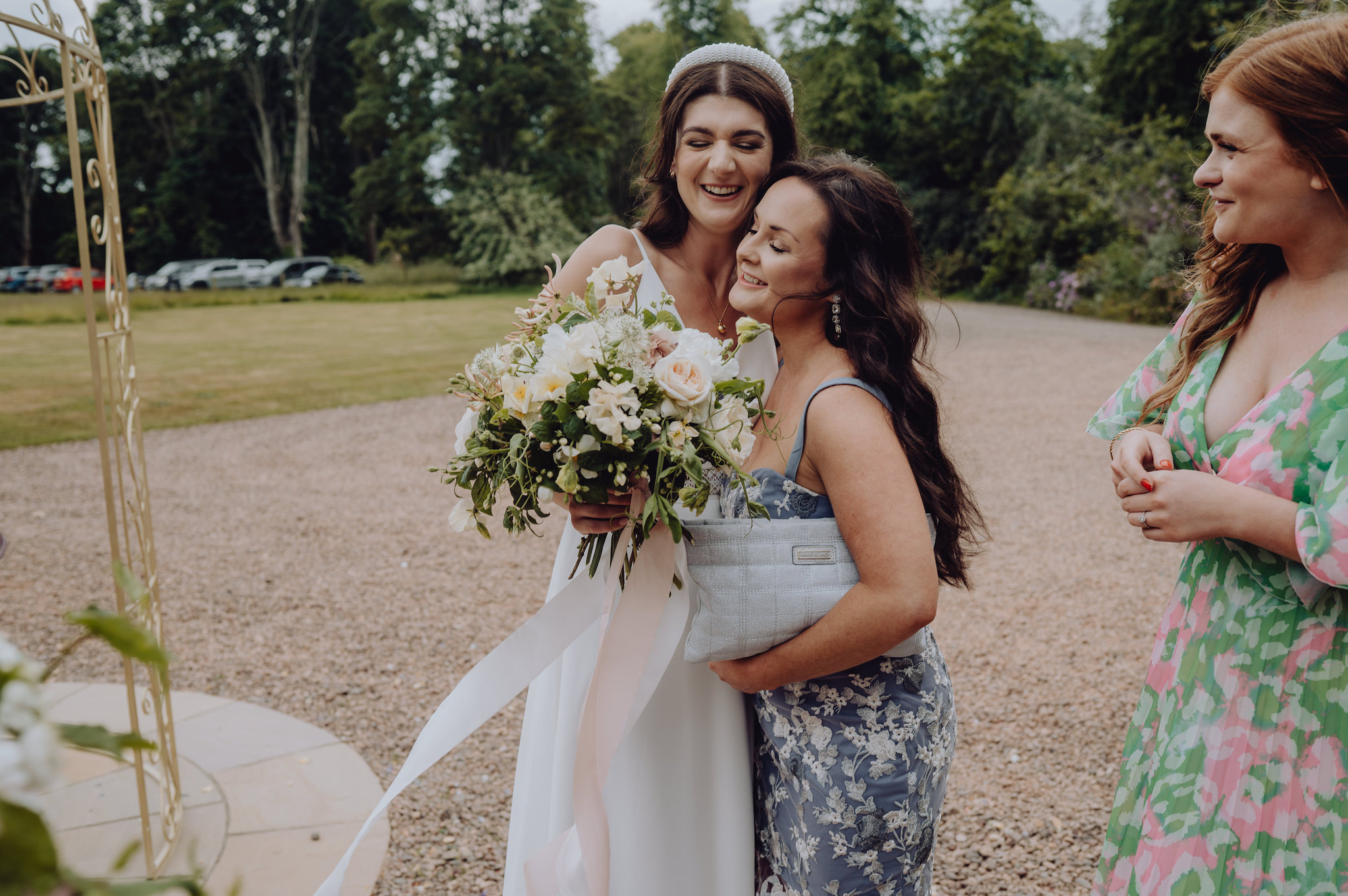 Bride hugging a wedding guest