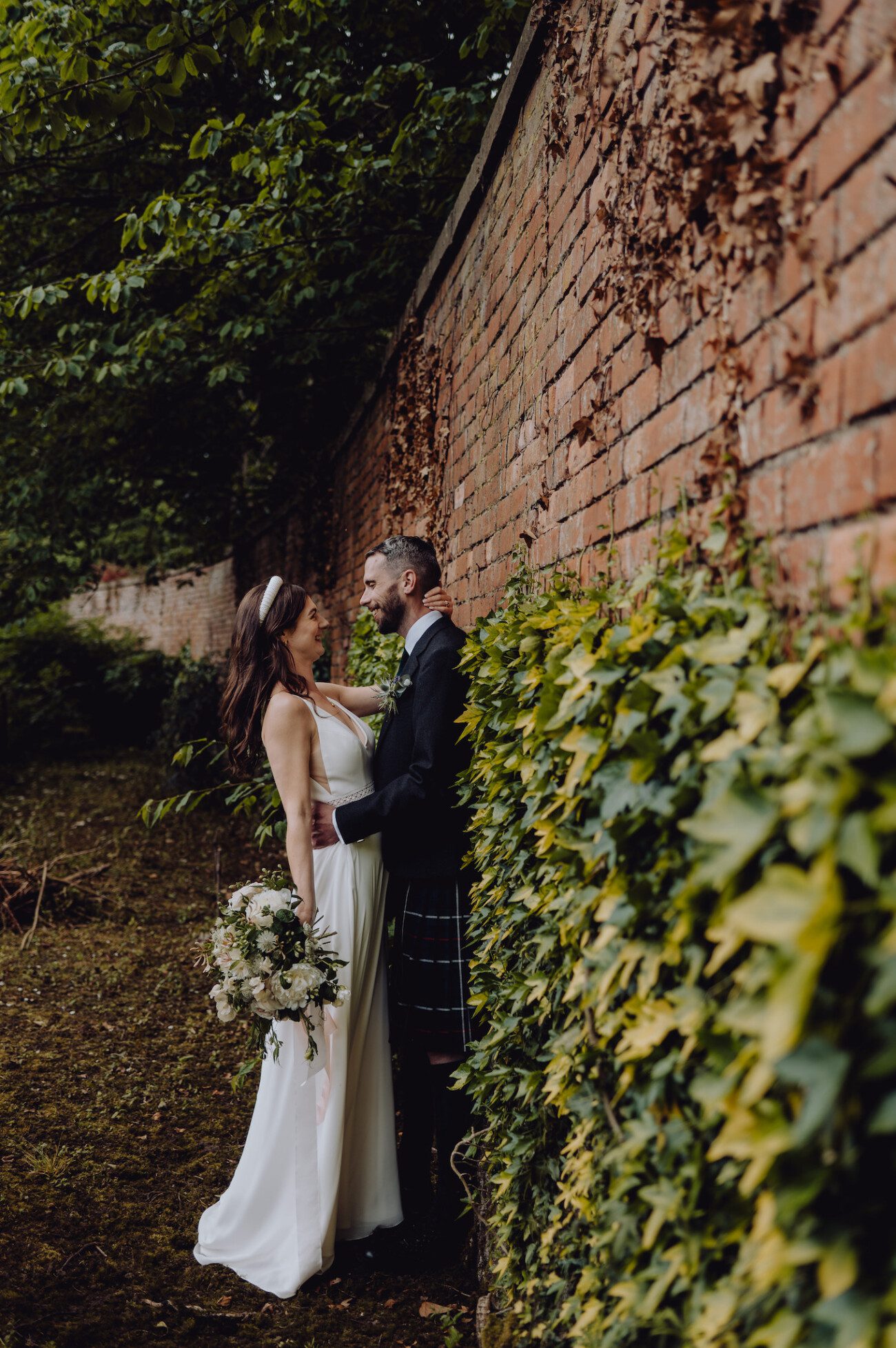 Bride and groom in walled garden